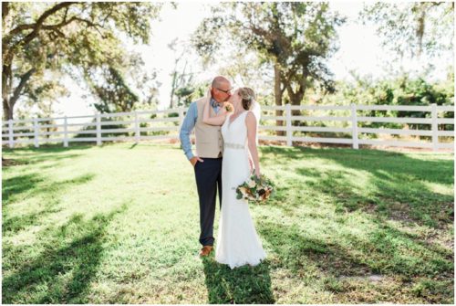 Couple kissing during a Up the Creek Farms Wedding