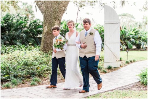 Bride's sons walking her down during a Up the Creek Farms Wedding