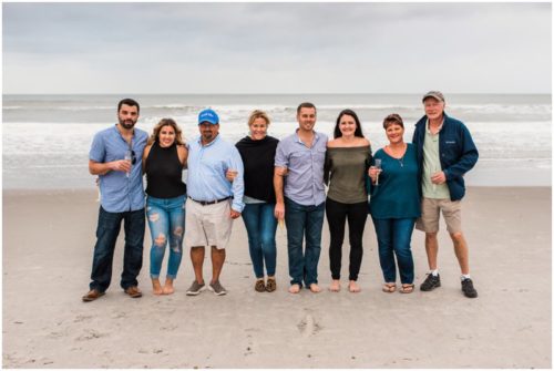Family together on beach at Cocoa Beach Proposal