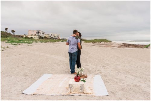 Couple kissing during Cocoa Beach Proposal