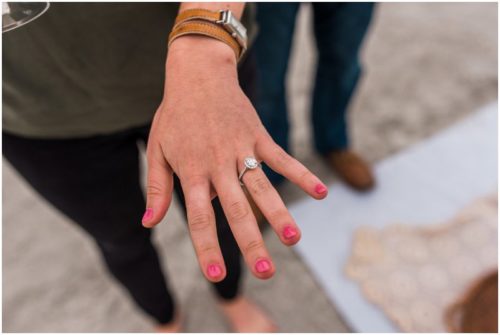 Bride showing off ring during Cocoa Beach Proposal