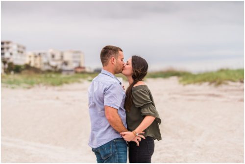 Couple kissing during Cocoa Beach Proposal