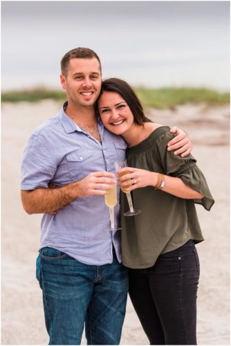 Couple with champagne during Cocoa Beach Proposal