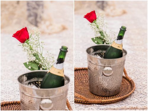 Champagne and a red rose on beach during Cocoa Beach Proposal