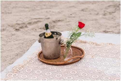 champagne and a rose during Cocoa Beach Proposal