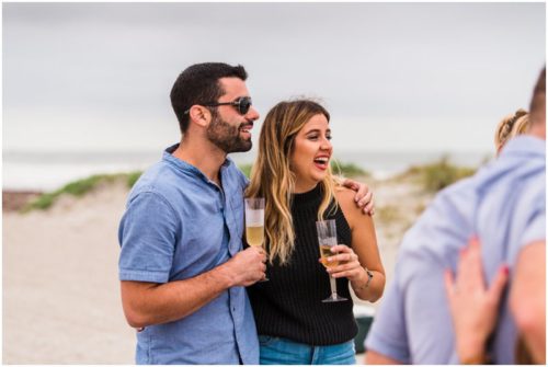 Family laughing during cocoa beach proposal