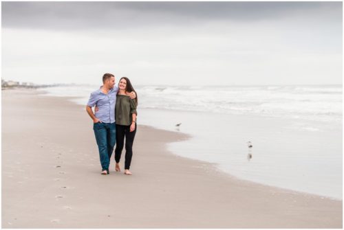 Couple together on beach during Cocoa Beach Proposal