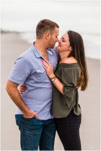 Couple together on beach during Cocoa Beach Proposal