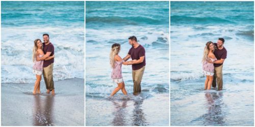 Couple playing in waves beach engagement