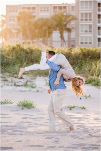 Couple having fun during beach engagement