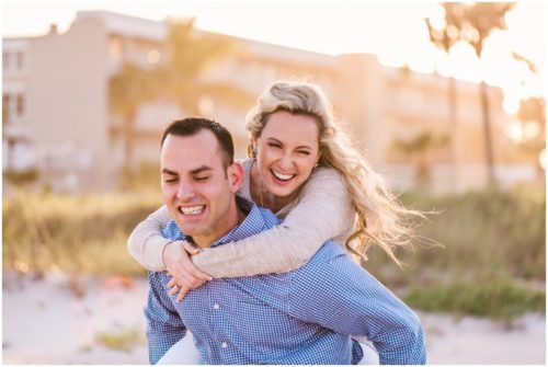 Couple having fun during beach engagement