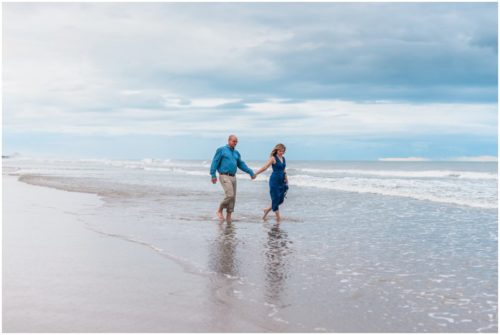 Couple walking on Beach Engagement