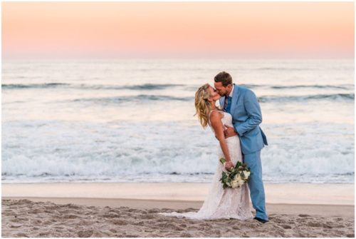 Couple on beach with pink sunset Satellite Beach Wedding