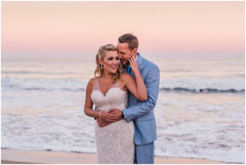 Couple on beach with pink sunset Satellite Beach Wedding