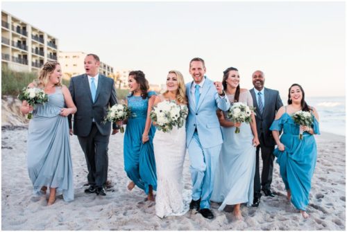 Wedding party walking on beach Satellite Beach Wedding