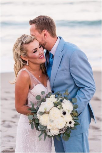 Couple on beach with pink sunset Satellite Beach Wedding