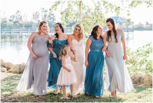 Bridesmaids walking by river Satellite Beach Wedding