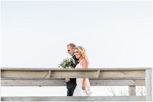 Bride walking with father onto the beach Satellite Beach Wedding