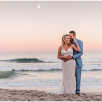 Couple on beach with pink sunset Satellite Beach Wedding