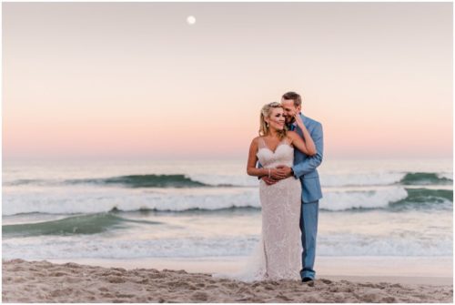 Couple on beach with pink sunset Satellite Beach Wedding