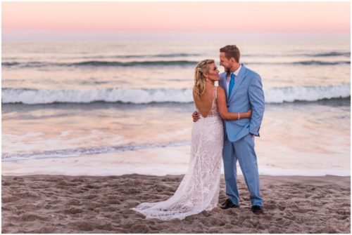 Couple on beach with pink sunset Satellite Beach Wedding
