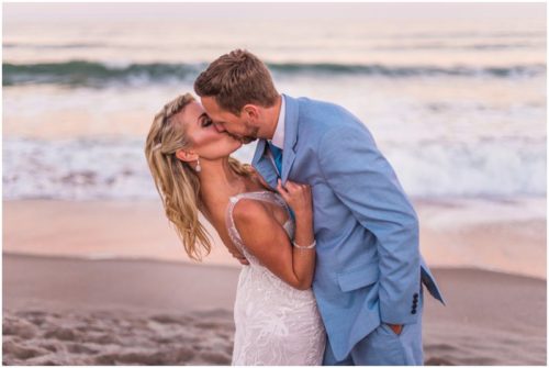 Couple on beach with pink sunset Satellite Beach Wedding