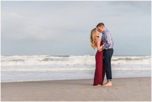 Couple kissing on beach during Cocoa Beach surprise proposal