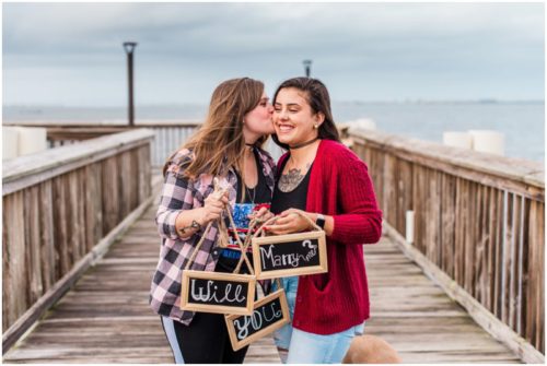 couple holding chalkboard signs during Florida proposal