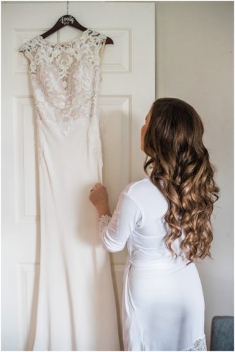 bride looking at dress during Bellewood Plantation wedding, Vero Beach, Florida