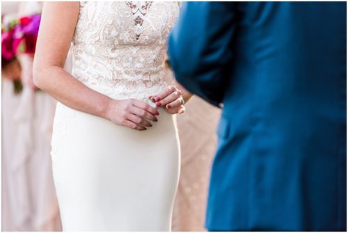 Bride holding ring during Bellewood Plantation wedding, Vero Beach, Florida