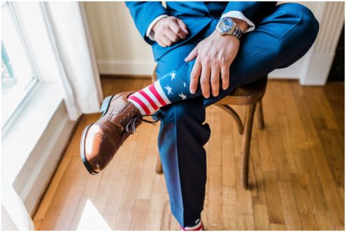 groom showing off socks during Bellewood Plantation wedding, Vero Beach, Florida