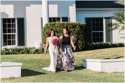 Bride walking with mom down asile during Bellewood Plantation wedding, Vero Beach, Florida