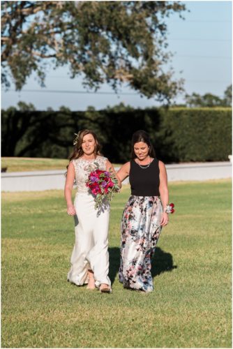 Bride walking with mom down asile during Bellewood Plantation wedding, Vero Beach, Florida