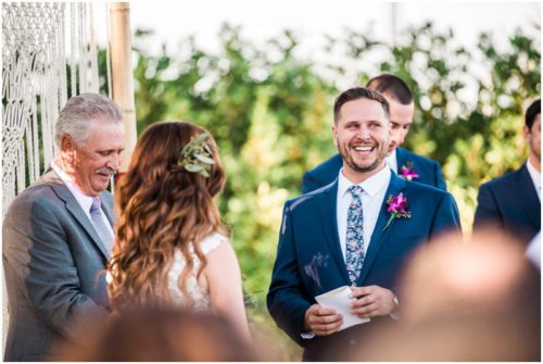 Groom laughing during Bellewood Plantation wedding, Vero Beach, Florida