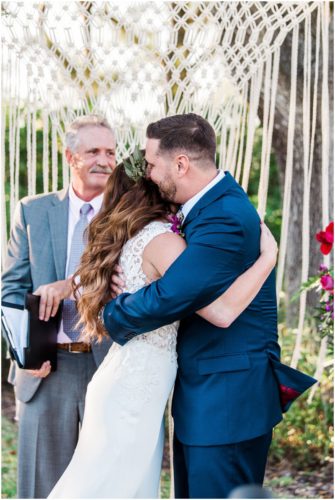 First kiss during Bellewood Plantation wedding, Vero Beach, Florida