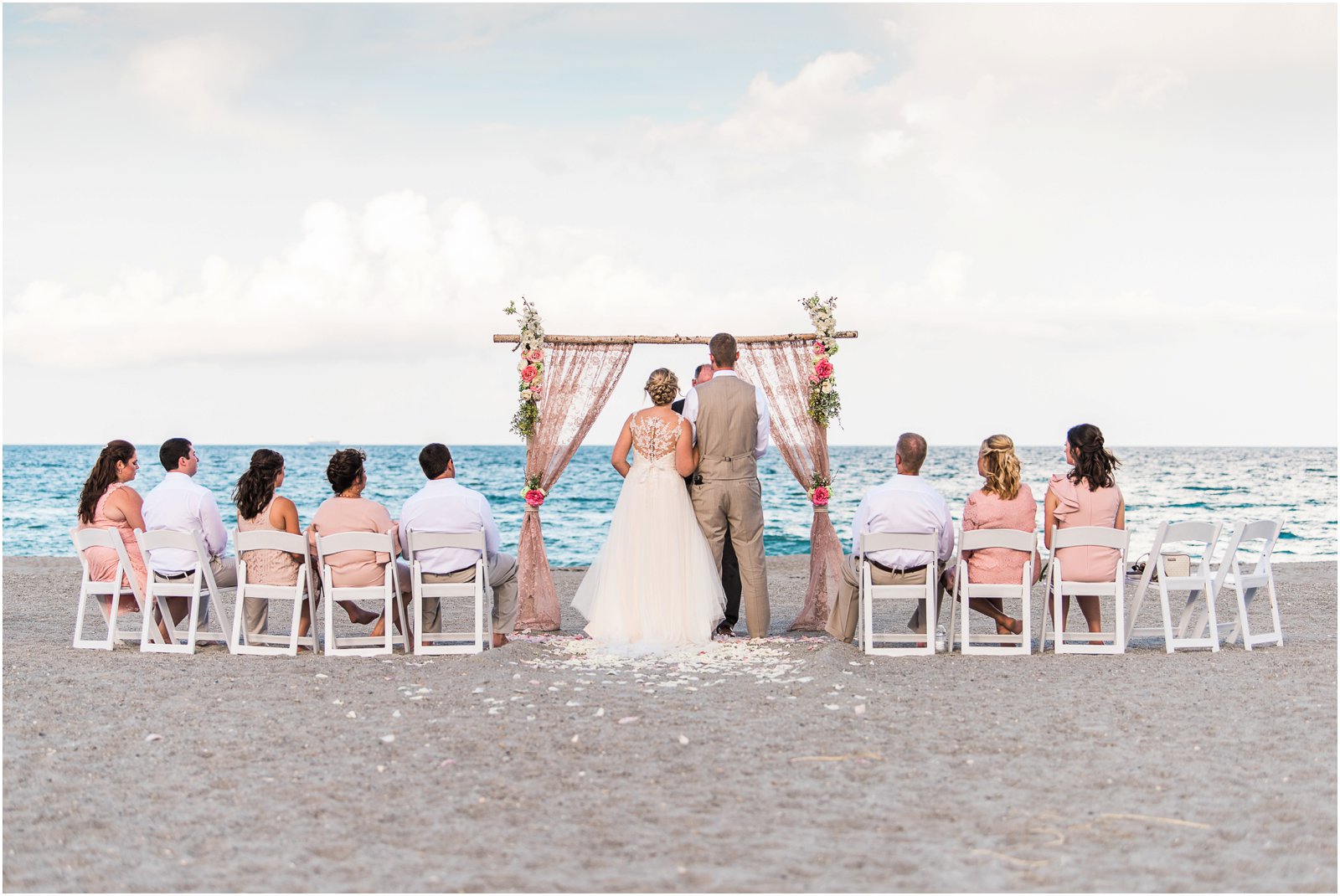 The entire wedding on the beach at sunset Cocoa Beach Wedding