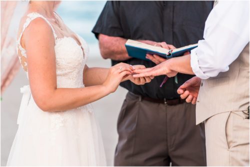 putting ring on the finger Cocoa Beach Wedding