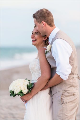 Bride laughing with groom Cocoa Beach Wedding