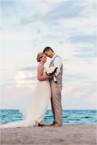Bride and groom on beach at sunset Cocoa Beach Wedding