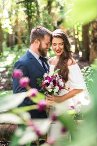 Bride and goom with purple bouquet at Florida Tech Botanical Garden Wedding
