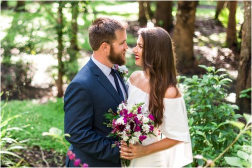 Bride and goom with purple bouquet at Florida Tech Botanical Garden Wedding