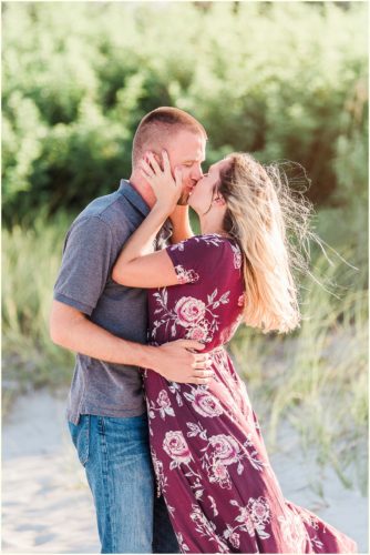 Couple kissing on beach Melbourne Florida engagement photographer