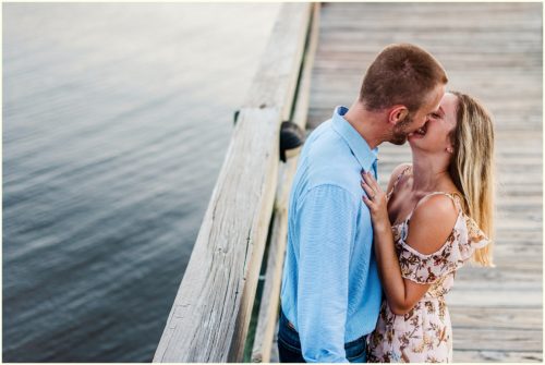 Couple kissing on dock Melbourne Florida Engagement Photographer