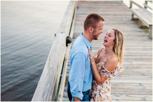 couple laughing on dock Melbourne Florida Engagement Photographer