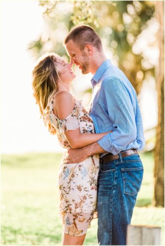 Couple kissing by river Melbourne Florida engagement photographer