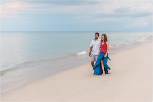 Couple walking on beach after storm Melbourne Beach Engagement Photography