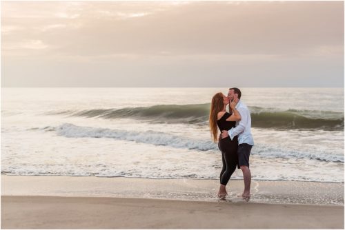 couple kissing by water Central Florida Sunrise Proposal