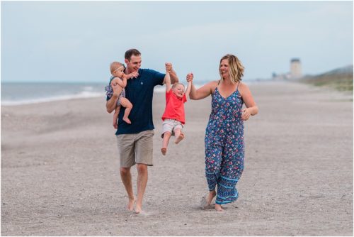 Family playing during Family Beach Portraits in Melbourne Beach, Florida