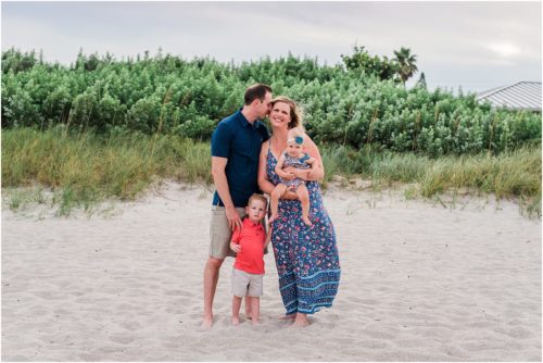 Family playing during Family Beach Portraits in Melbourne Beach, Florida