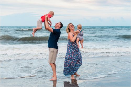 Family playing in ocean during Family Beach Portraits in Melbourne Beach, Florida